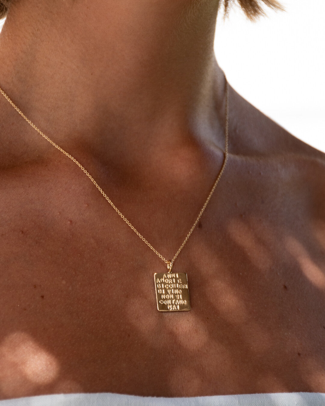 "Anni amori e bicchieri di vino non si contano mai" necklace