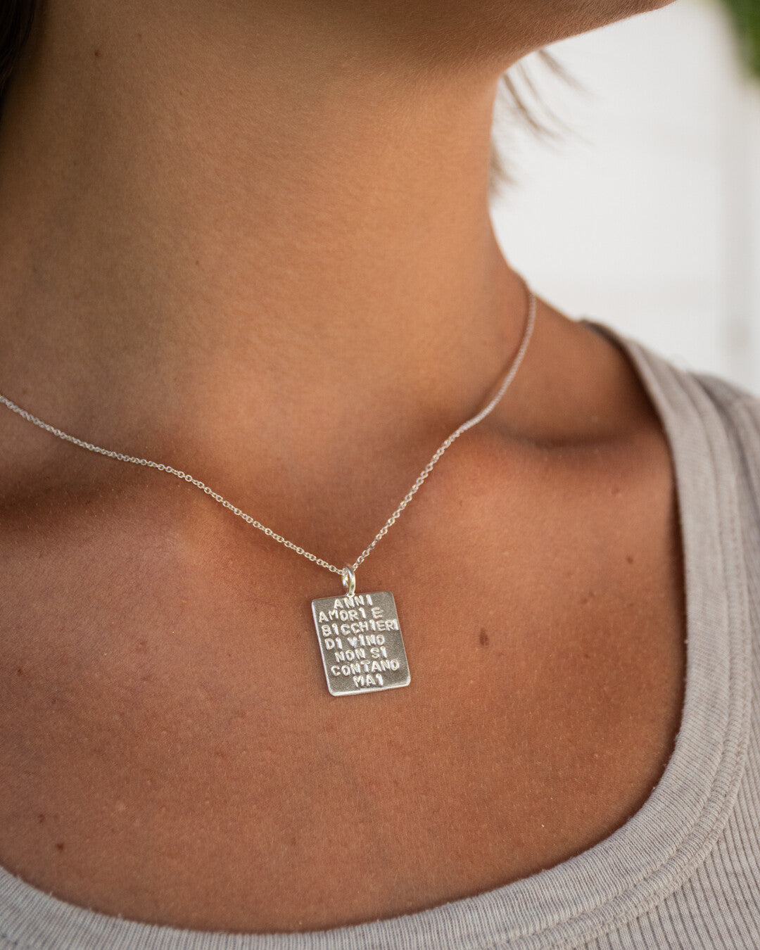 "Anni amori e bicchieri di vino non si contano mai" necklace