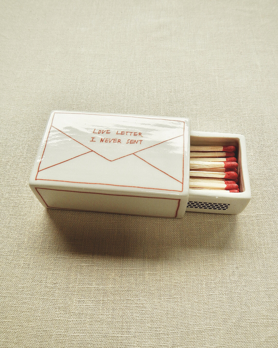 Scatola di fiammiferi illustrata in ceramica