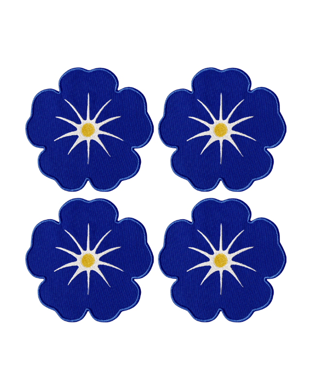 Octaevo Morning Glory Coasters (set of 4) feature blue florals with star centers and yellow dots on linen-cotton blend.