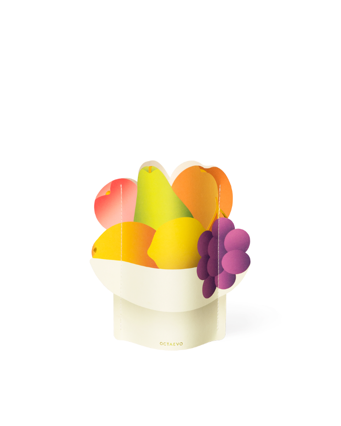 The OCTAEVO Fruit Bowl Mini Paper Vase features colorful paper cutouts of pears, lemons, orange, apple, and grapes.
