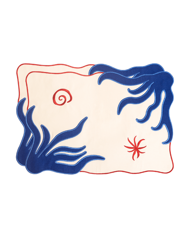 OCTAEVO Amalfi Placemats (Set of 2) feature abstract cream, blue waves, red swirls, and an embroidered-look border.