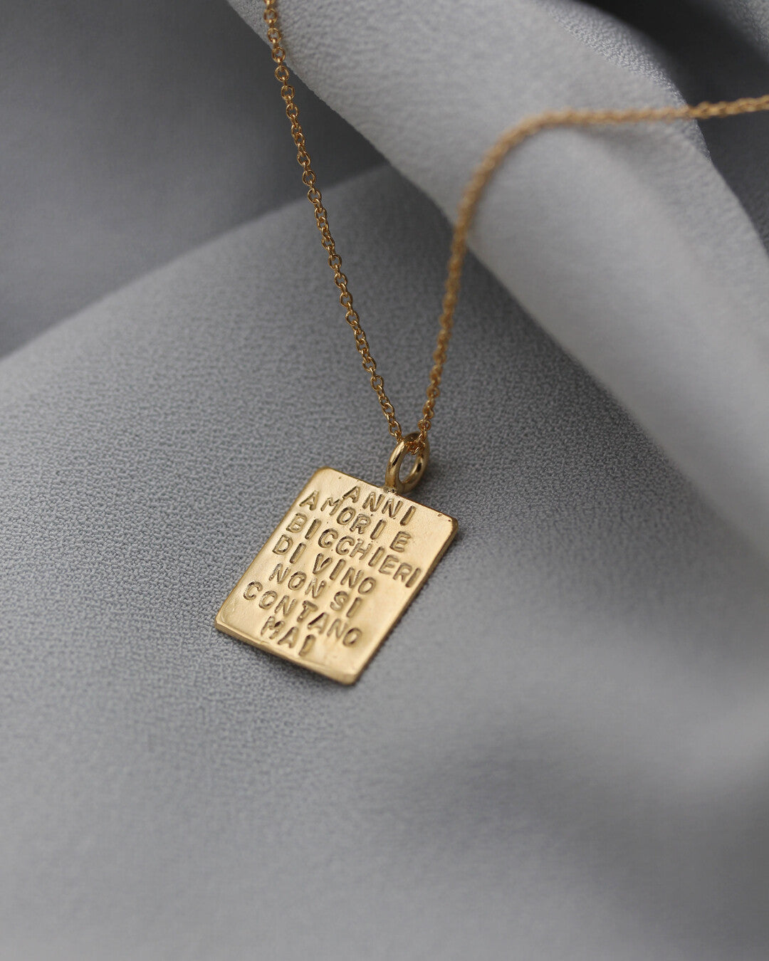 "Anni amori e bicchieri di vino non si contano mai" necklace
