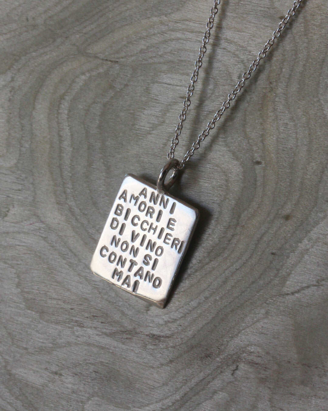 "Anni amori e bicchieri di vino non si contano mai" necklace
