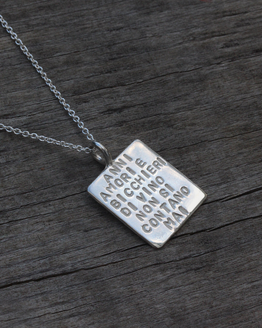 "Anni amori e bicchieri di vino non si contano mai" necklace