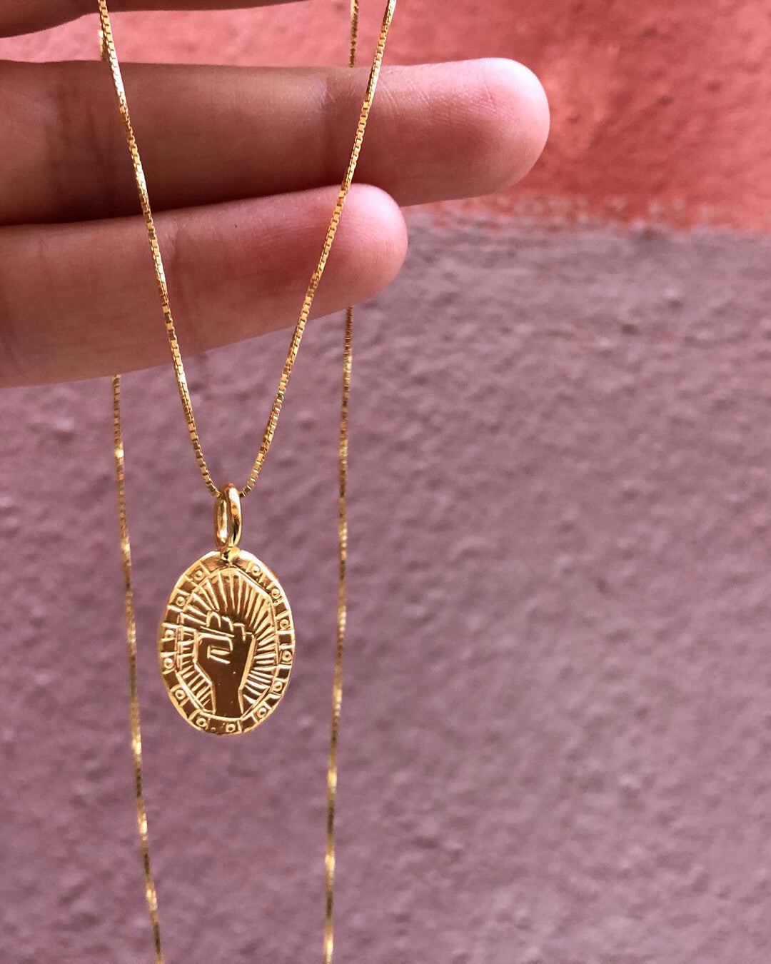 Fist necklace