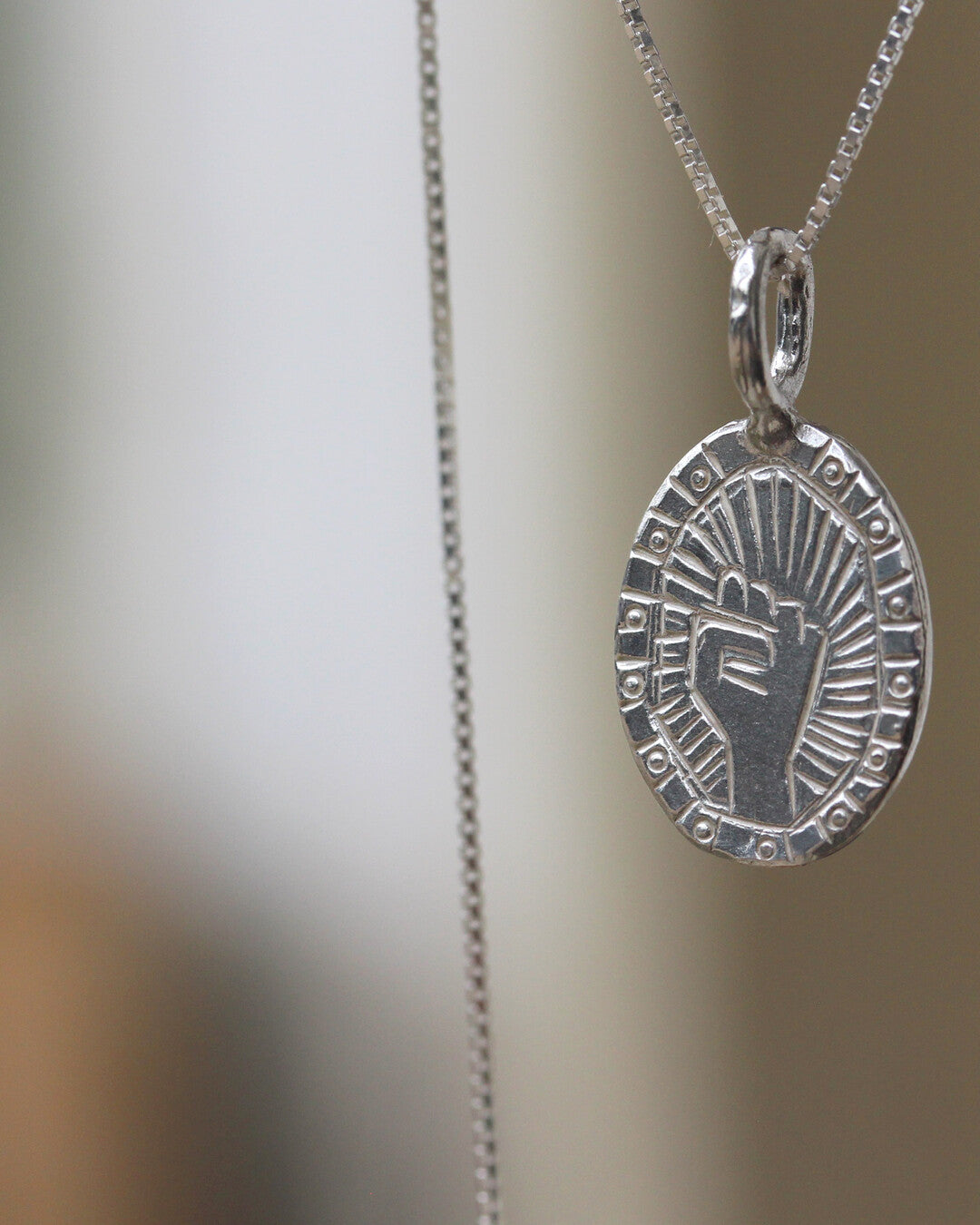 Fist necklace
