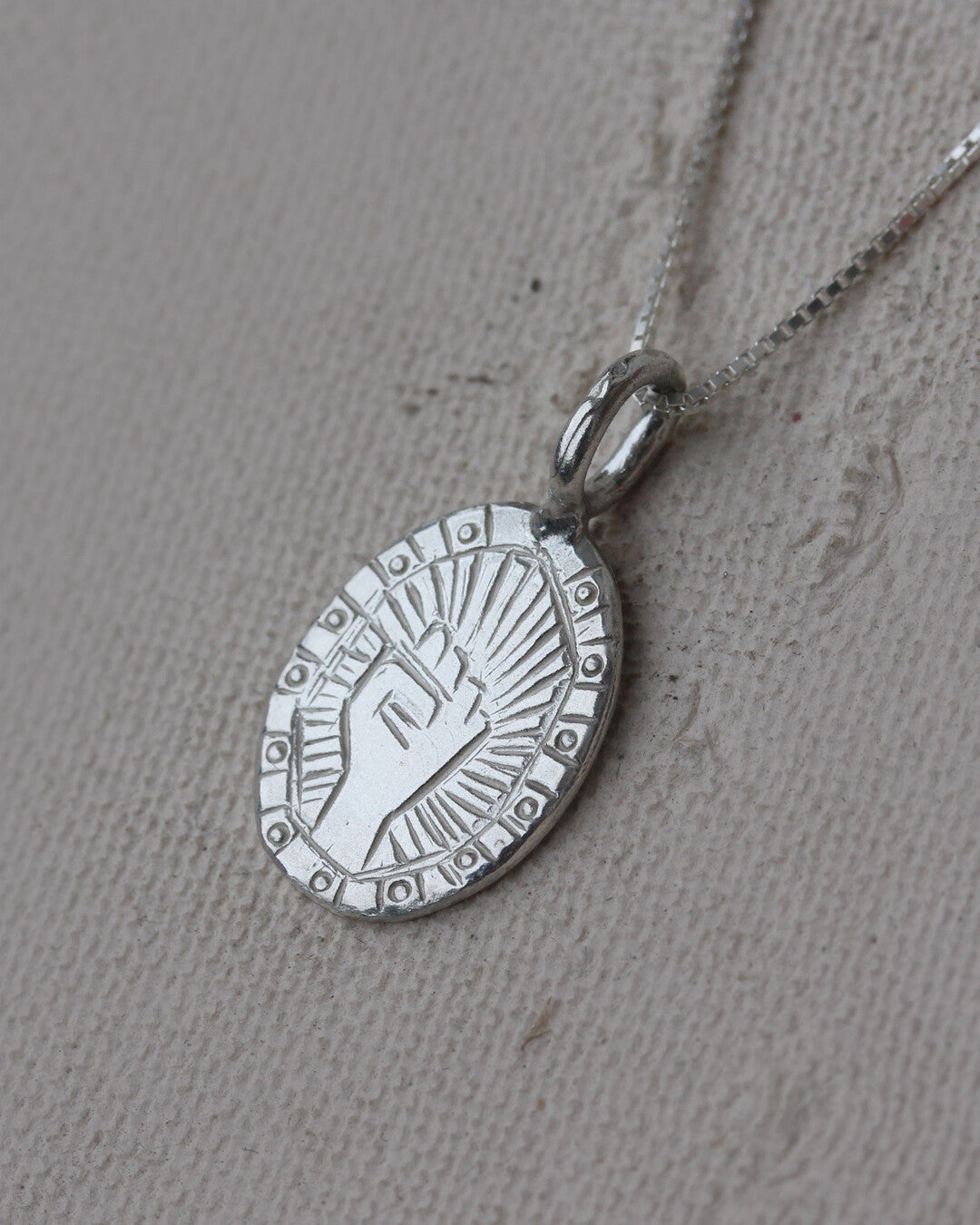 Fist necklace