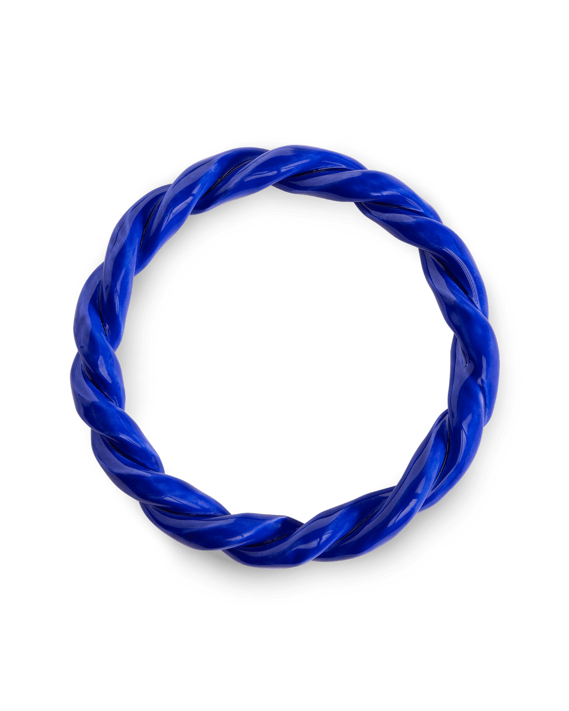 The Sicilia Ceramic Trivet by OCTAEVO features a twisted blue design in a circular wreath shape on a white background.