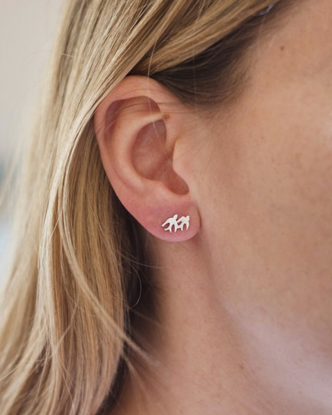 Silver swallow earrings worn
