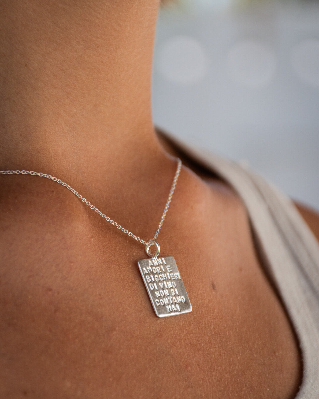 "Anni amori e bicchieri di vino non si contano mai" necklace