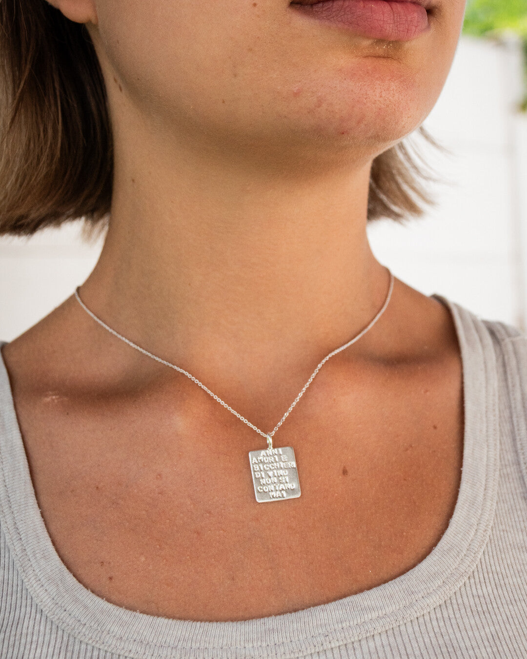 "Anni amori e bicchieri di vino non si contano mai" necklace