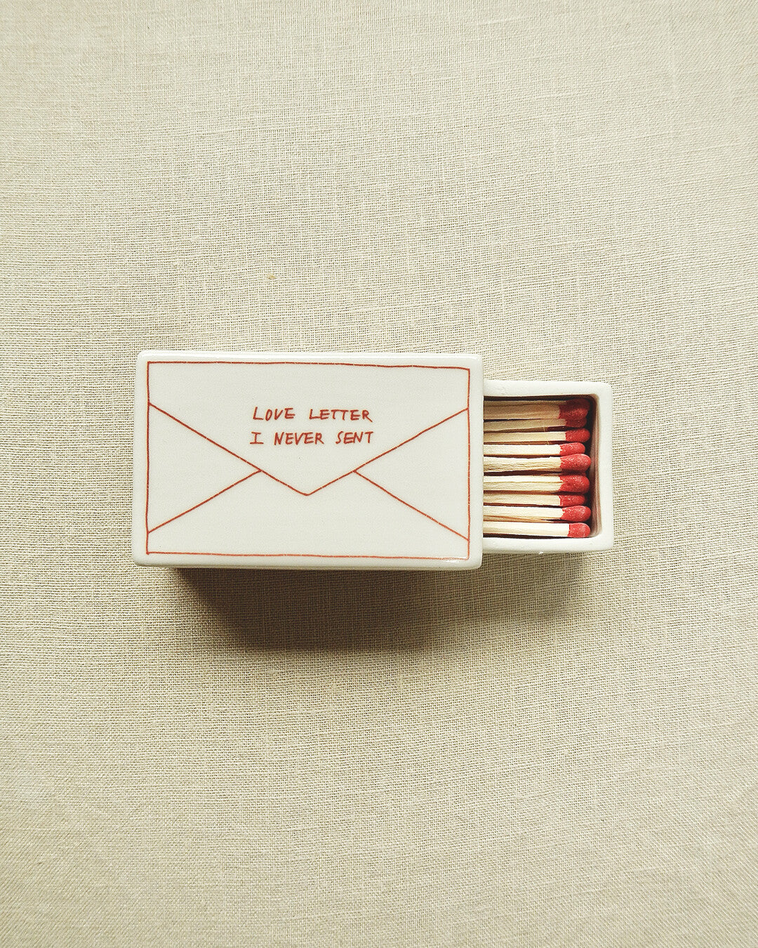 Scatola di fiammiferi illustrata in ceramica