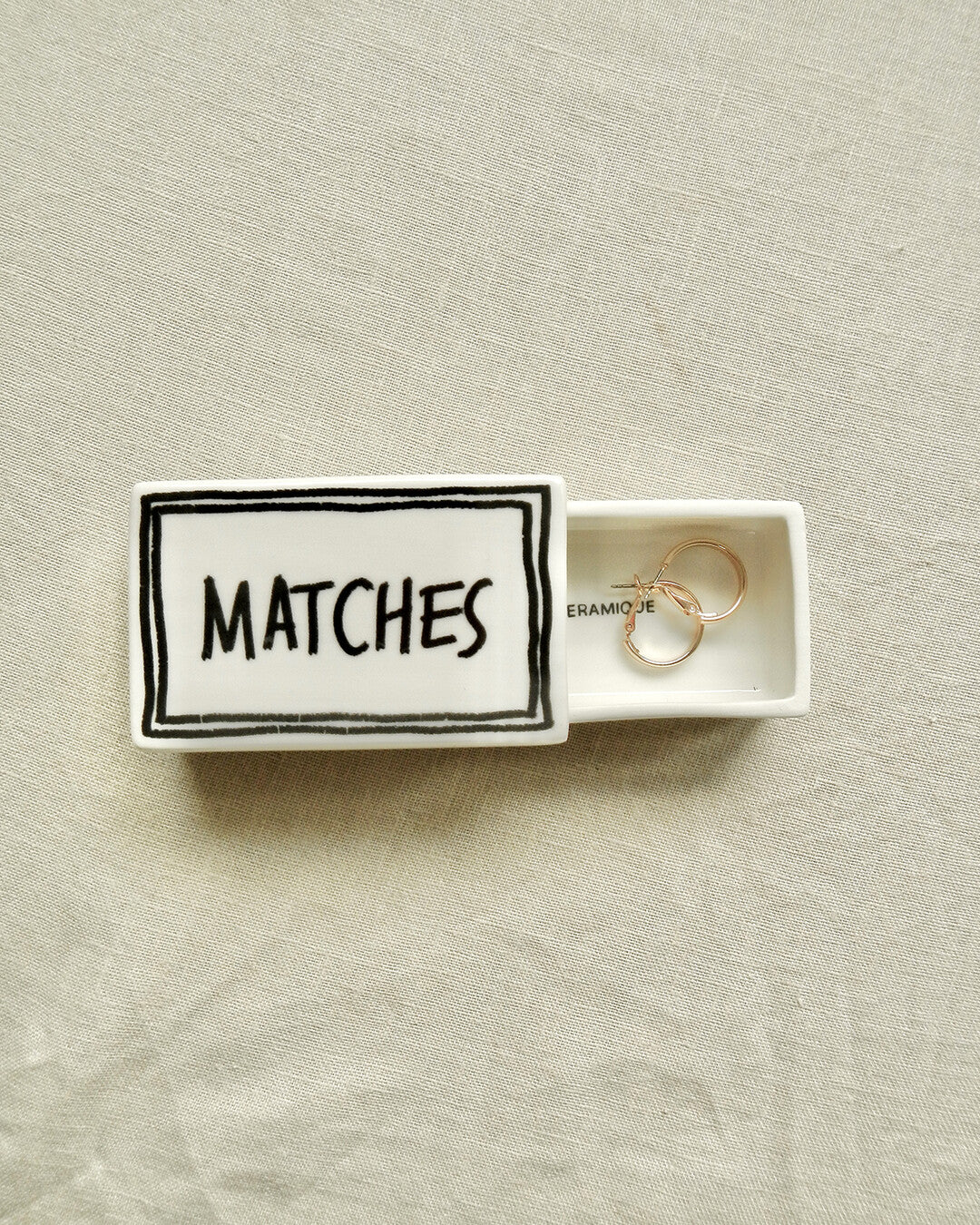 Scatola di fiammiferi illustrata in ceramica