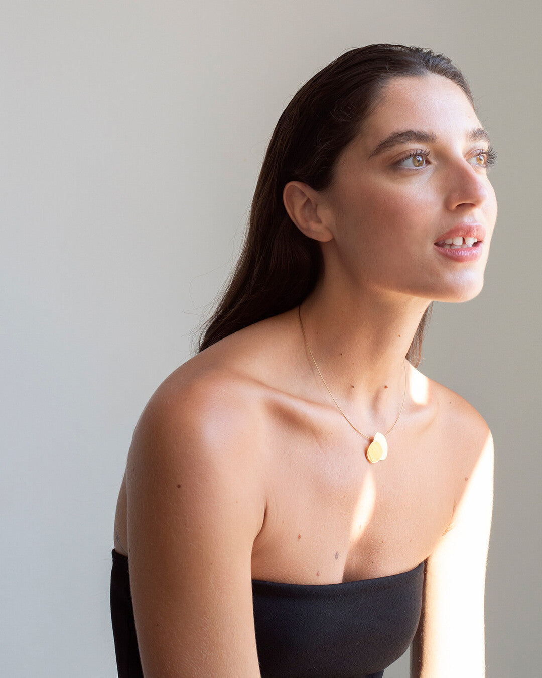 Golden necklace with pendant Eclipse