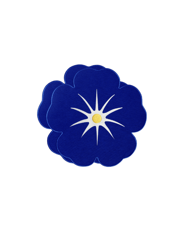 Octaevo’s Morning Glory Placemats (Set of 2): blue flower with white starburst, great for embroidered table decor.