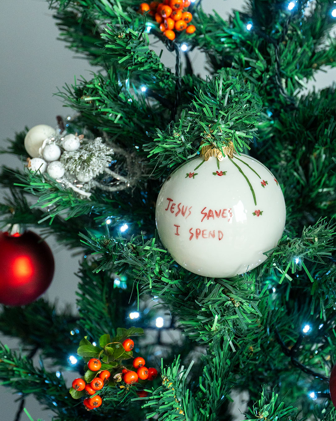 "Jesus Saves I Spend" Christmas ball