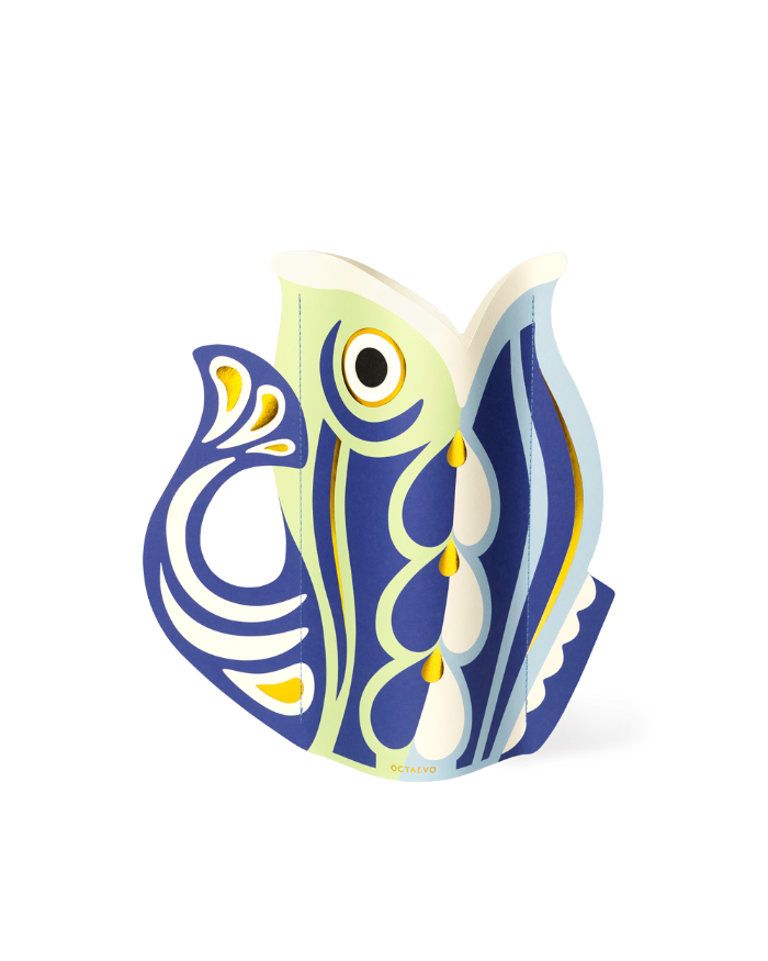 The OCTAEVO Fish Paper Vase features bold Mediterranean-inspired abstract patterns in a stylized fish shape.