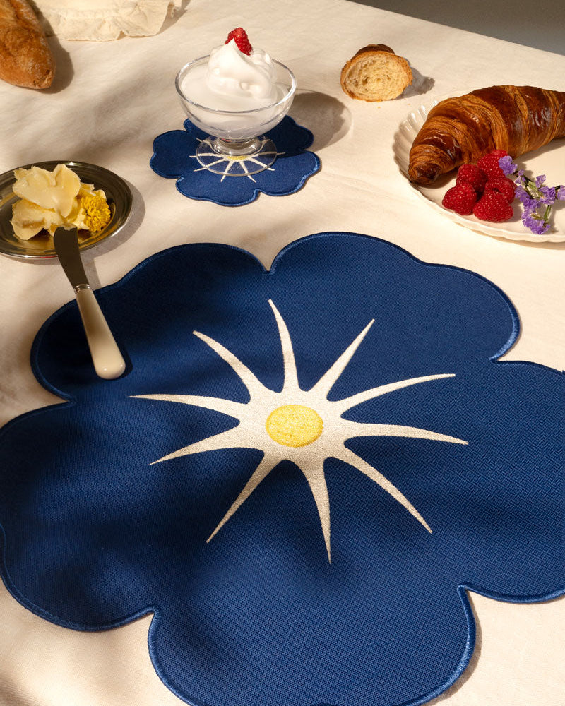 Octaevo Morning Glory Placemats (Set of 2) on a breakfast table with croissant, butter, raspberries, and dessert.