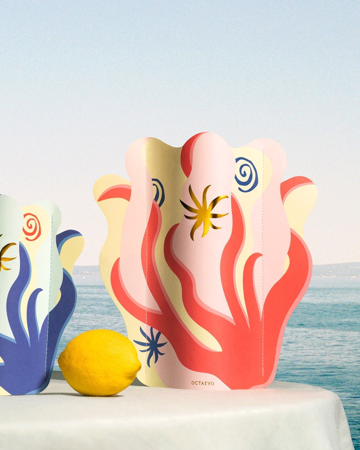 The Amalfi Mini Paper Vase by Octaevo features colorful abstract designs inspired by the Amalfi Coast.